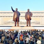 К бронзовым статуям Ким Ир Сена и Ким Чен Ира возложили корзины цветов руководящие работники, трудящиеся и военнослужащие